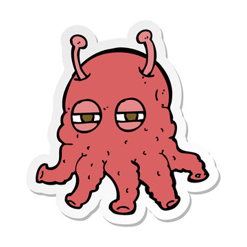 sticker of a cartoon alien face