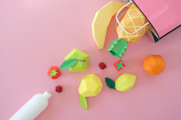 exotic fruits made of paper on pink background