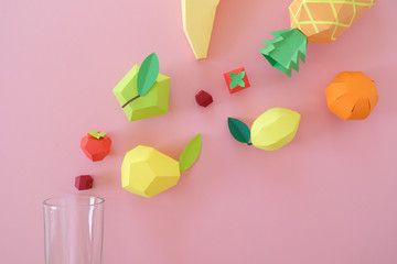 exotic fruits made of paper on pink background