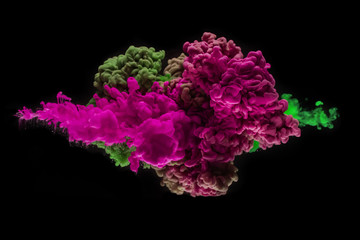 Coloured acrylic ink mixing in water on black