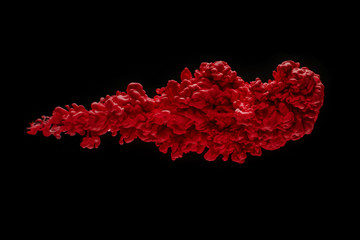 Coloured acrylic ink mixing in water on black