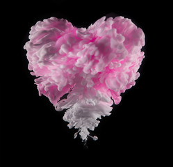 Coloured acrylic ink in heart shape on black
