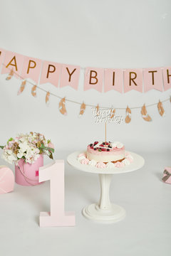 pink decoration for the first year photo session cake smash