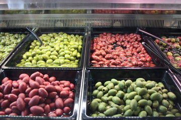homegrown olives. four different types, light green, dark, red, exposed to the market for the sale of greedy people