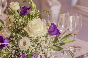 Premium catering arrangement with flowers and glasses. High class catering for e.g. a wedding, birthday or business meeting