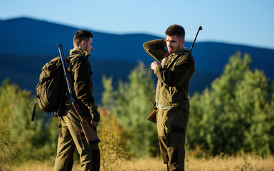 Friendship of men hunters. Military uniform. Army forces. Camouflage. Hunting skills and weapon...
