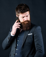 Another working day. Bearded man with smartphone. Male formal fashion. brutal caucasian hipster with moustache. businessman in suit. business communication. Mature hipster with beard speak on phone