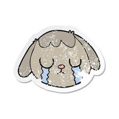 distressed sticker of a cartoon dog face crying