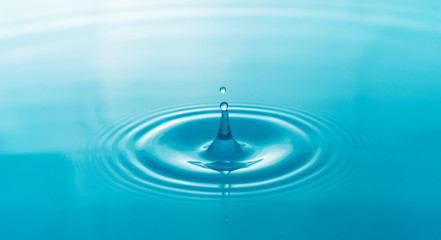 Water droplets on surface water background