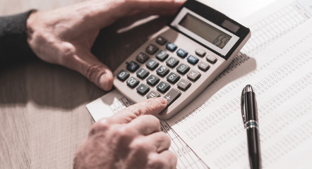 Hand using calculator, accounting concept