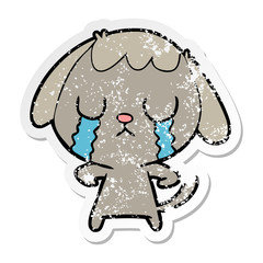 distressed sticker of a cute cartoon dog crying