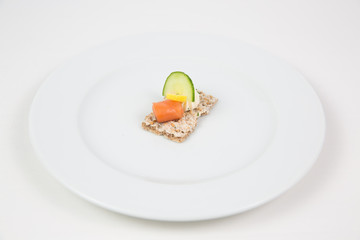 bites of salmon and cucumber