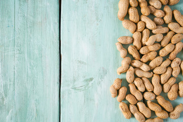 peanuts on wooden surface