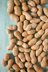 peanuts on wooden surface