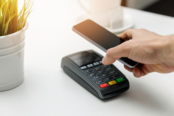 nfc contactless payments - paying bill with phone
