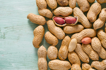 peanuts on wooden surface