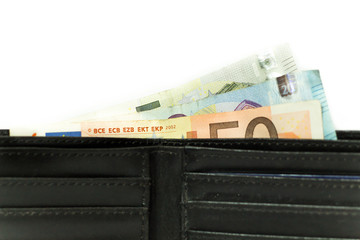 Euro banknotes and coins. Money in the wallet. Economy in Europe