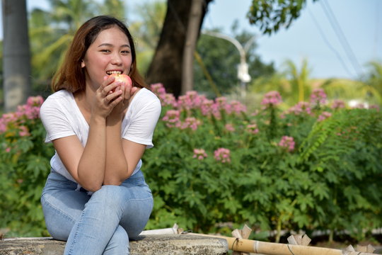 Youthful Filipina Female Eating