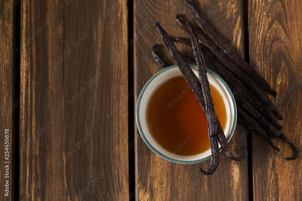 Sticker vanilla extract on wooden surface