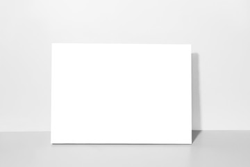 Blank canvas, gray wall on background. Mockup poster frame.