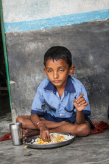 Indian School Boy having lunch