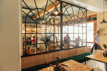 People sitting and talking over drinks in a bar
