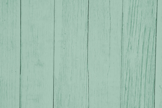 Weathered light green textured wood background