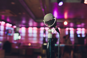Microphone. Retro microphone. A microphone on stage. A pub. Bar. Restaurant. Classic. Evening....