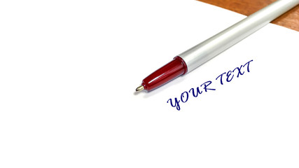 ballpoint pen lying on a piece of paper