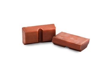 Macro photo of Chocolate bar. Broken pieces over white background
