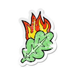 retro distressed sticker of a cartoon burning eaf symbol