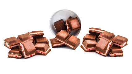 stack of dark chocolate pieces with filling isolated on white background