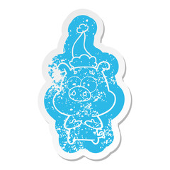 happy cartoon distressed sticker of a pig wearing santa hat