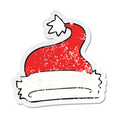 retro distressed sticker of a cartoon christmas hat