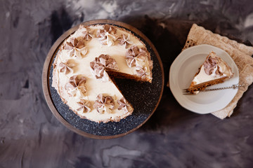 Homemade Kiev cake, dacquoise cake with butter cream and hazelnuts top view