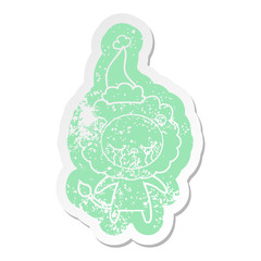 crying cartoon distressed sticker of a lion wearing santa hat