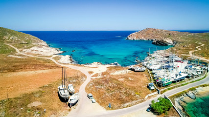 Obraz premium Aerial view of quay with sailing boats on trailers on the shore of Paros island, Greece. Boats launching process