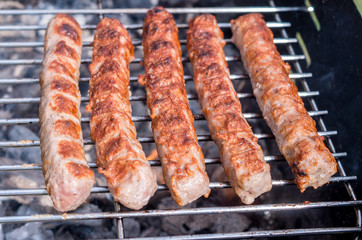 Grilling. Cooking barbecue with charcoal in the garden. T