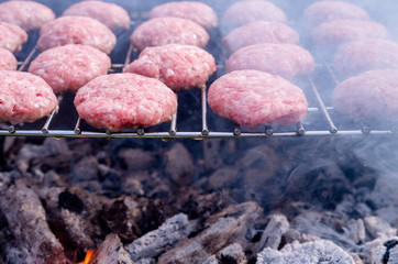 Grilling meatballs on the grill. Cooking  barbeque with charcoal in garden.