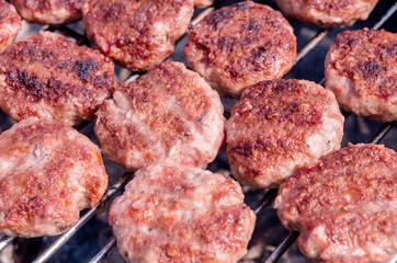 Grilling meatballs on the grill. Cooking  barbeque with charcoal in garden.