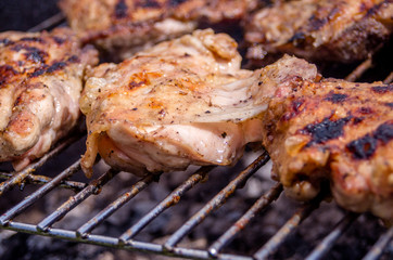 Chicken steak on the grill. Cooking chicken on the barbeque with charcoal in garden.