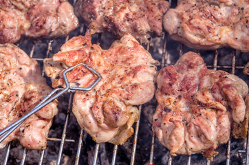 Chicken steak on the grill. Cooking chicken on the barbeque with charcoal in garden.