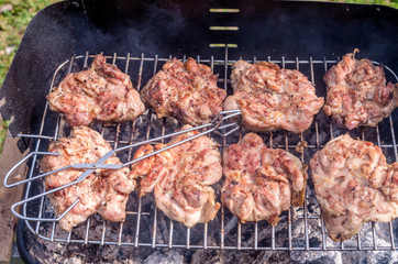 Chicken steak on the grill. Cooking chicken on the barbeque with charcoal in garden.