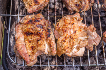 Chicken steak on the grill. Cooking chicken on the barbeque with charcoal in garden.