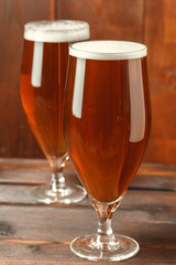Glass beer on wood background