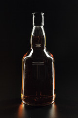 bottle of whiskey, or rum, or alcohol stands