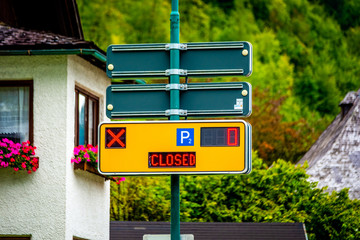 Naklejka premium Yellow modern parking sign with digital screens, parking closed