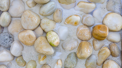 Beach stones background. Top view.