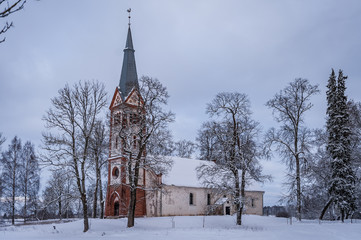 Krimulda Evangelical Lutheran Church on the hill in the wintertime. Krimulda, Latvia.