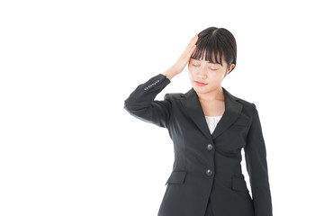 頭痛に苦しむ若いビジネスウーマン